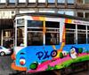 Guru colora le strade di Milano con i tram dipinti dallo street artist Pao