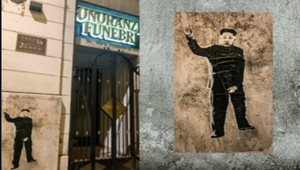 Kim Jong-un in una street-art dell’artista Laika fa gesti scaramantici accanto agli uffici dell’agenzia di pompe funebri Taffo